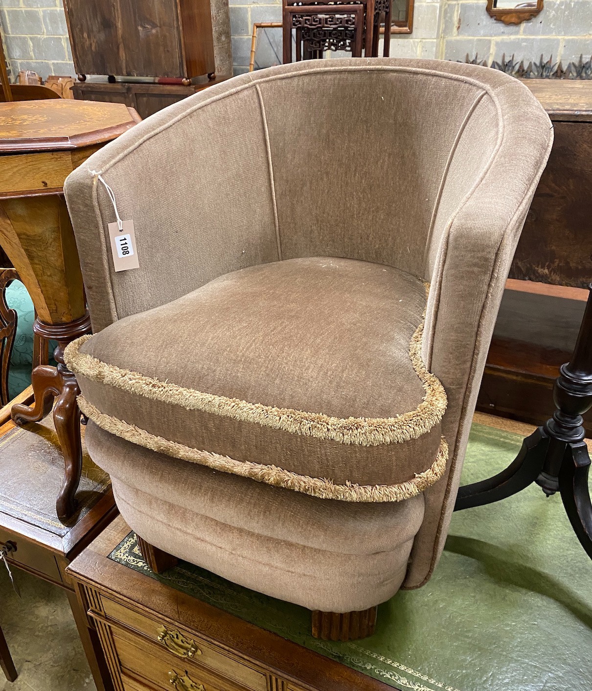 A late 19th century Flemish carved oak dining chair, a pole screen and an upholstered tub chair